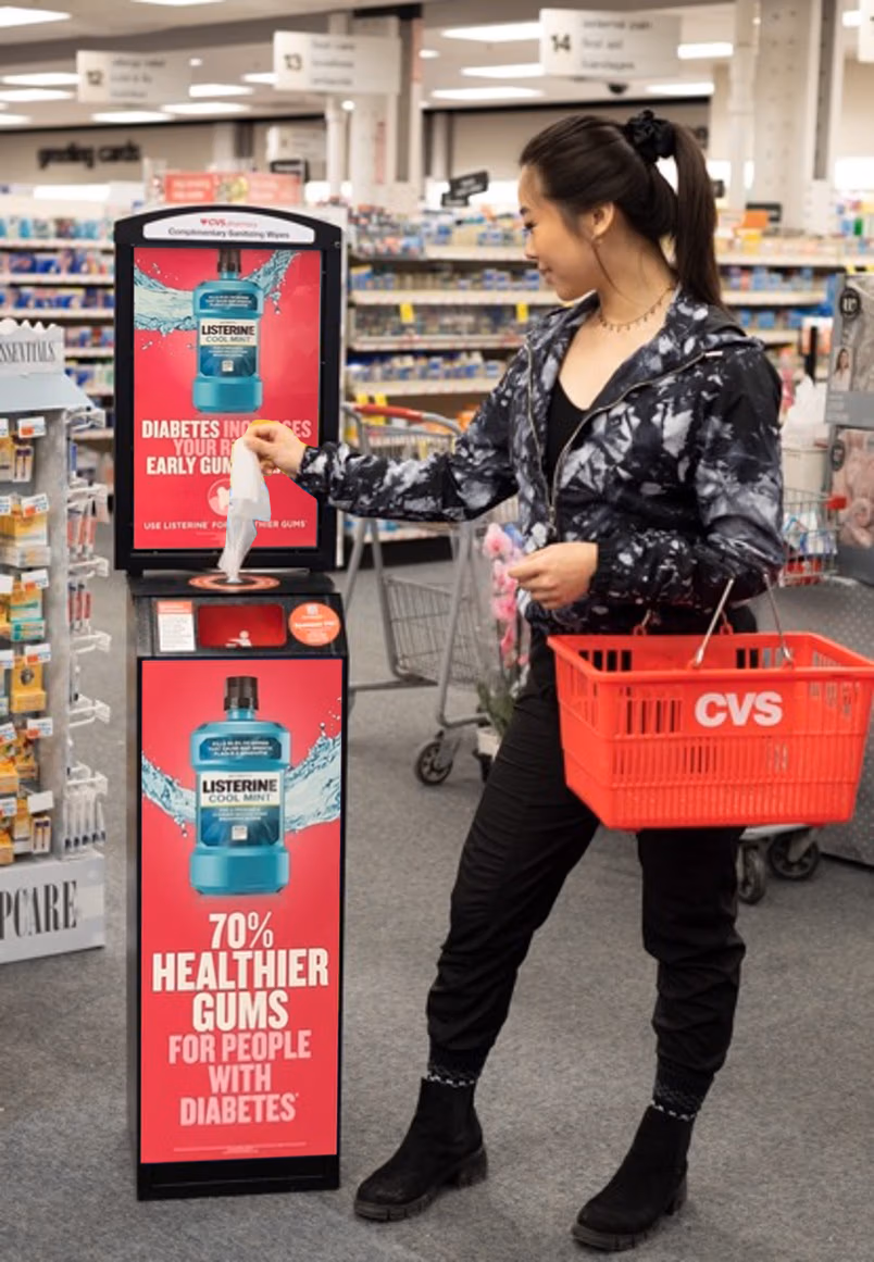 person using the Terraboost wellness kiosk advertisement for Listerine